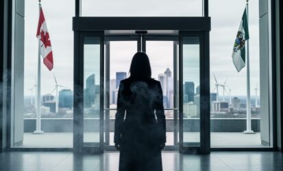 “A blurred figure at a modern Canadian government entrance with climate haze and distant wind turbines in the background, representing stalled climate leadership.”